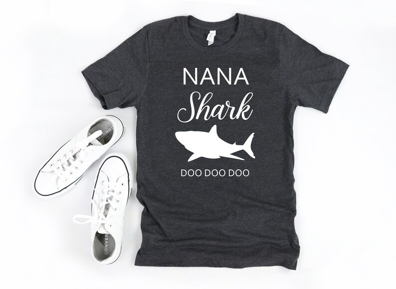 a t - shirt that says nana shark and a pair of sneakers