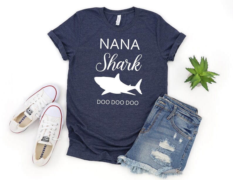 a t - shirt that says nanna shark and a pair of shorts