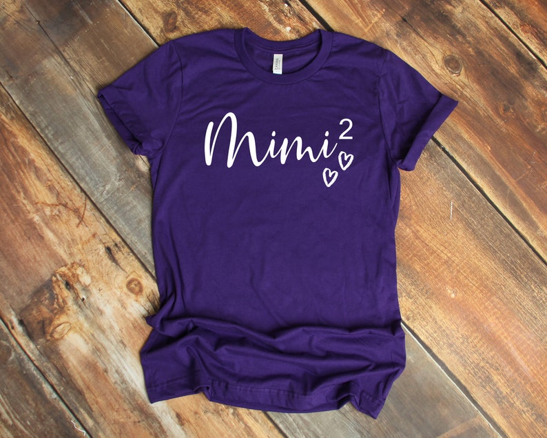 a purple shirt with the word mnnj on it
