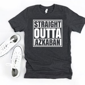 a t - shirt with the words straight, outta, and a pair of