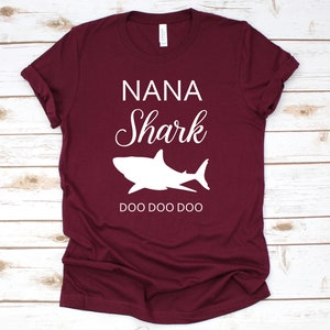 a maroon shirt that says nanna shark doo doo doo doo doo doo doo doo