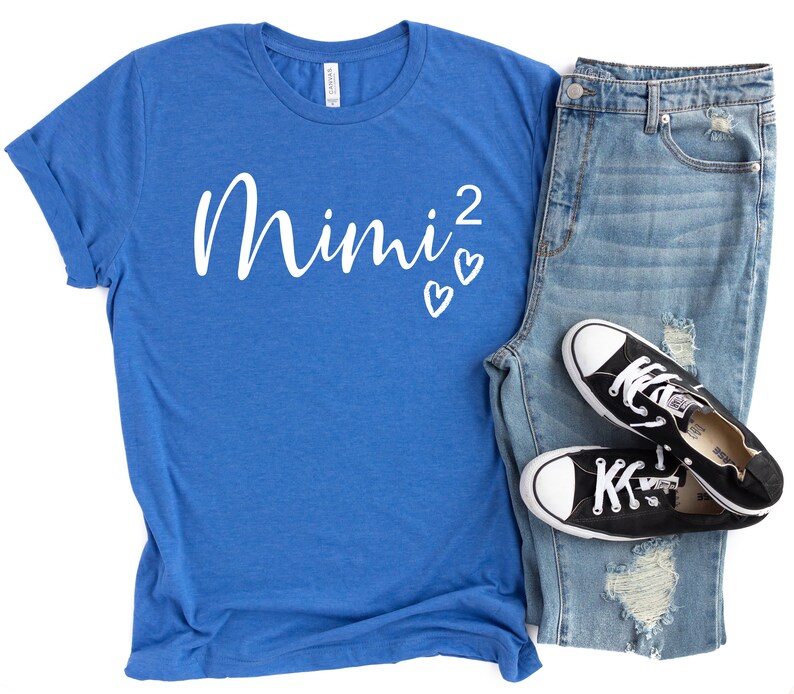 a pair of jeans and a t - shirt with a pair of sneakers