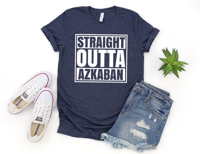 a t - shirt that says straight outa akkaban next to a pair