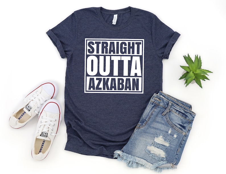 a t - shirt that says straight outa akkaban next to a pair