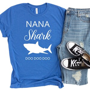 a blue shirt that says nanna shark and a pair of ripped jeans