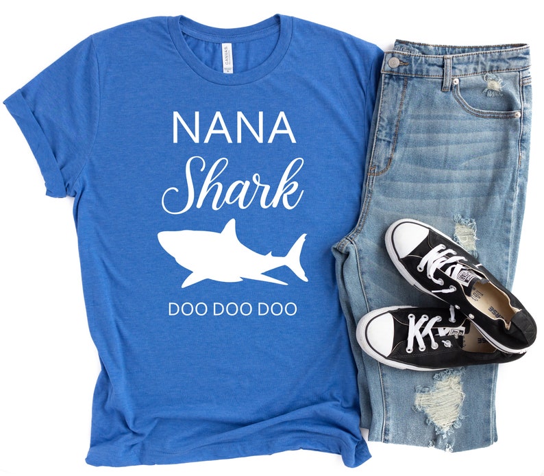 a blue shirt that says nanna shark and a pair of ripped jeans