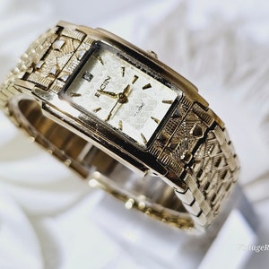 Reloj elgin dorado con diamantes sale