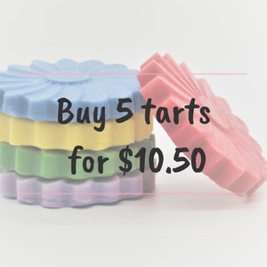 May include: Five colorful wax tarts shaped like flowers, stacked on top of each other. The text "Buy 5 tarts for $10.50" is written on the image.