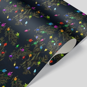 May include: Dark blue wrapping paper with a repeating pattern of colourful light bulbs strung on pine branches.