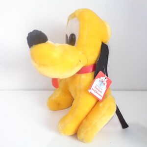 Cachorro de pelúcia vintage Disney Pluto da Disneylândia com etiqueta original