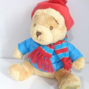 Disney Store Winnie the Pooh Bear dressed in Blue Quilted Jacket + red Hat 10 in