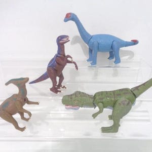 Bundel van 4 vintage beweegbare dinosaurussen van K & M 2001