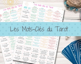 May include: A colorful chart with the French words "Les Mots-Clés du Tarot" at the top. The chart lists the tarot cards with their corresponding keywords in French. The chart is printed on white paper and has a light blue background.