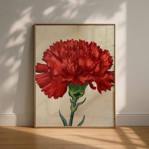 May include: A framed wall art print featuring an oil painting of a single vibrant red carnation flower with ruffled petals and a green stem, set against a textured, neutral beige background within a thin, metallic gold-colored frame.