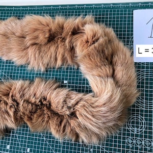 Stripes of arctic fox fur are beige with black splashes Scrap fur Fox scraps Natural arctic fox fur   Long furry scraps project