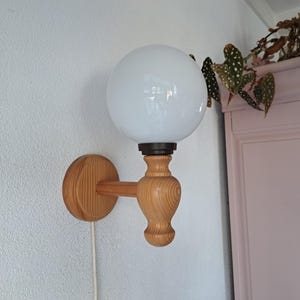 Wooden wall lamp with glass ball shade 80s