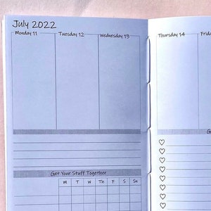 May include: Open notebook with a weekly planner layout for July 2022. The left page shows the days Monday through Wednesday, with a section labeled "Get Your Stuff Together." The right page displays Thursday through Sunday, with a "Get to Work" section and a list of hearts.