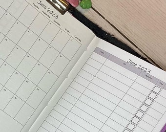May include: A black and white planner with a monthly calendar for June 2023 and a daily log for June 2023. The calendar has a grid layout with each day of the month in a separate square. The daily log has a column for the date, a column for the task, and a column for whether the task is complete.