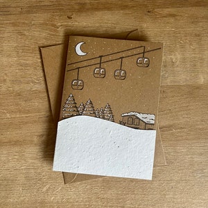 Winter Christmas Snowy Ski Scene Card, fatto in casa, rifinito a mano e personalizzabile. Realizzato su cartoncino riciclato.