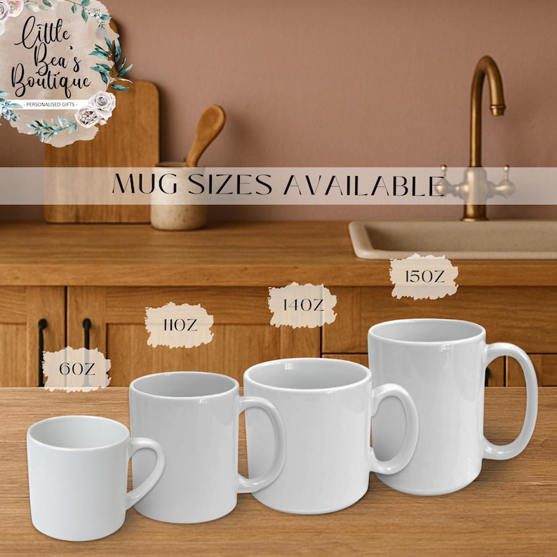 May include: Four white ceramic mugs of varying sizes are displayed on a wooden surface. The mugs are labeled 6oz, 11oz, 14oz, and 15oz. The text "MUG SIZES AVAILABLE" is above the mugs. The background includes a kitchen setting.