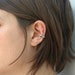 see more listings in the Ear cuff. section