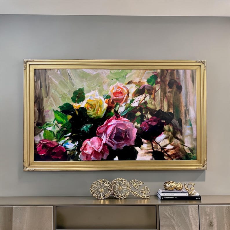 May include: A rectangular oil painting in a gold frame featuring a bouquet of roses in shades of pink, yellow, and deep red with green leaves. The brushwork is visible and textured, set against a soft, abstract background of light green and brown.