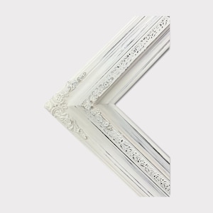 May include: White ornate picture frame with a distressed finish. The frame has a decorative, raised design around the edges.