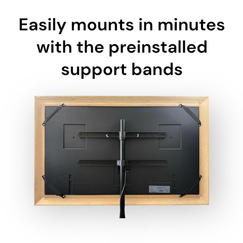 May include: The back of a wooden framed television with a black stand attached. The stand is mounted to the wall and has two black support bands on each side of the television.