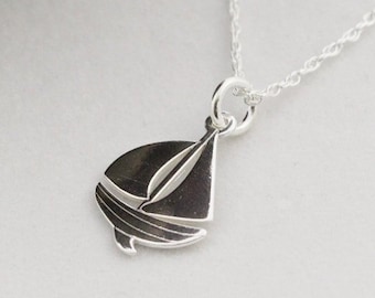 long necklace with steel chain and brass pendant in the shape of a sailboat handmade
