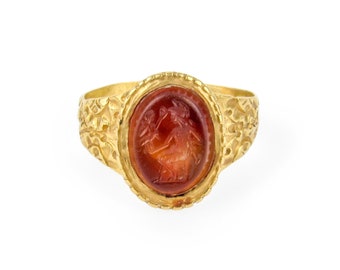 Early High Karat Gold Carnelian Intaglio Ring of Jupiter Holding Victory