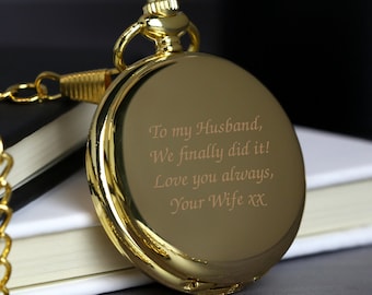 May include: Gold pocket watch with a chain. The back of the watch is engraved with the message "To my Husband, We finally did it! Love you always, Your Wife xx".