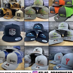 May include: A collage of various embroidered hats with different designs and colors. The hats are all trucker style with a mesh back and a front panel. Some of the designs include a mountain range, a heart, a lobster, a deer, and a car. The hats are all in different colors, including black, gray, green, blue, and orange.