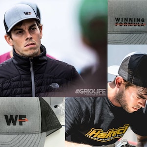 May include: Two men wearing gray and black baseball caps with the text "WF" and "WINNING FORMULA" embroidered on them. The caps have a black mesh back.