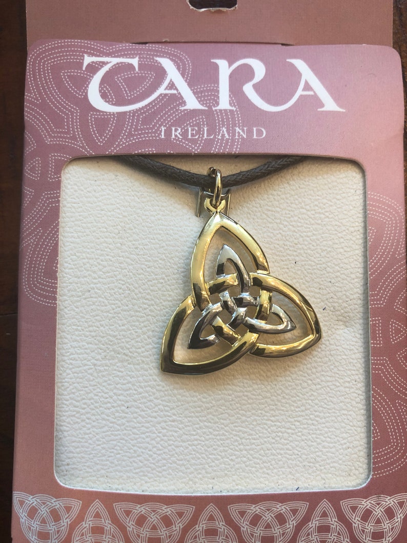silver and gold trinity on a leather necklace band ...man or woman.. made in Ireland by solvar