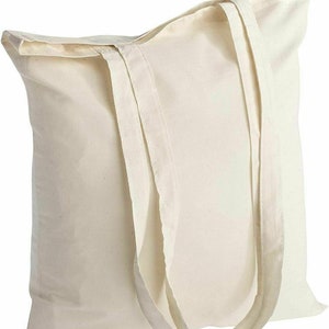 May include: A plain white canvas tote bag with two long handles. The bag is made of natural cotton and has a simple, unbleached look.