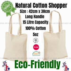 May include: Two natural cotton shopper bags with long handles. The bags are 42 cm by 38 cm and have a 15 liter capacity. The bags are made of 100% cotton and are 5 oz. The bags are eco-friendly and have a "Confidence in Textiles" label.
