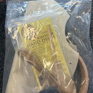 May include: A rawhide hand drum kit with a wooden drum stick, leather, and instructions. The kit includes all the materials needed to make a drum.