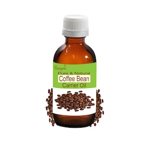 May include: A brown glass bottle with a white lid, labelled "Bangola Pure & Natural Coffee Bean Carrier Oil". The label has a green background and a picture of coffee beans.