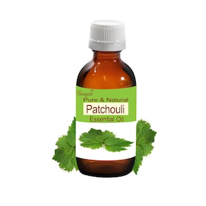 May include: A brown glass bottle with a white cap, labelled "Bangoto Pure & Natural Patchouli Essential Oil". The bottle is surrounded by green leaves.
