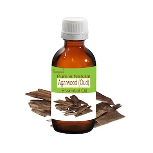 May include: A brown glass bottle with a white cap, labeled "Pure & Natural Agarwood (Oud) Essential Oil" with the brand name "Bangoia" in green. The bottle is surrounded by pieces of dark brown wood.