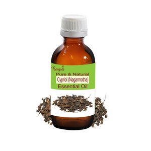 May include: A brown glass bottle of Cypriol (Nagarmotha) essential oil with a white cap and a green and white label. The label reads "Pure & Natural Essential Oil". Dried roots are scattered around the bottle.