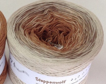 May include: A ball of beige and brown yarn with a white label that reads "Steppenwolf 200g Lauflänge ca 760m - 50% Baumwolle 4fädig".