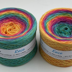 May include: Two skeins of colorful yarn, each in a different colorway. The yarn is called "Loco" and is 60% cotton and 40% bamboo. The skeins are 250g each and have a length of 950m.