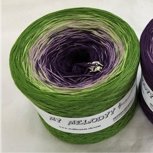 May include: A skein of green, purple and pink ombre yarn with the text "MY MELODY" and "www.wolltraum.ch.com" on the label.