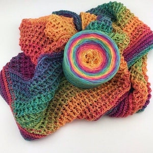 May include: A rainbow colored yarn ball with a crocheted scarf made from the same yarn.