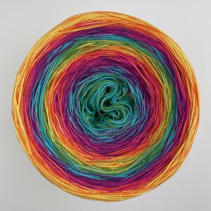 May include: A ball of yarn with a rainbow of colors, including yellow, orange, red, purple, blue, green, and teal.