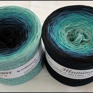 May include: Two skeins of yarn, one black and green ombre called "Illuminati" and one blue and green ombre called "Melody" by "wolltraum.de".