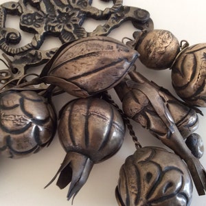 Big Vintage Penca de Balangandan; Metal. Brazil. Mid century. It is a traditional amulet filled with protective, symbolic or grateful charm