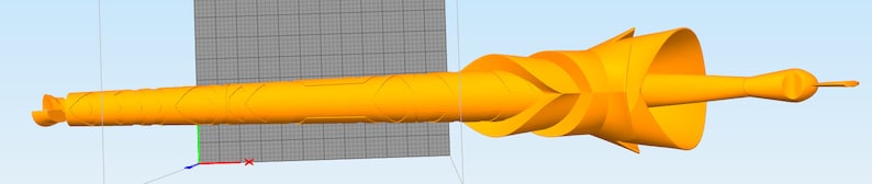 May include: A 3D printed orange model of a long, thin, spiraled object with a pointed tip. The object is designed with a series of grooves and ridges along its length.