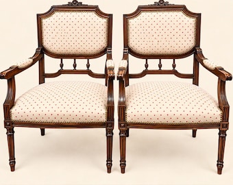 Pair of Louis XVI style armchairs, carved wood, ivory fabric, brass nails